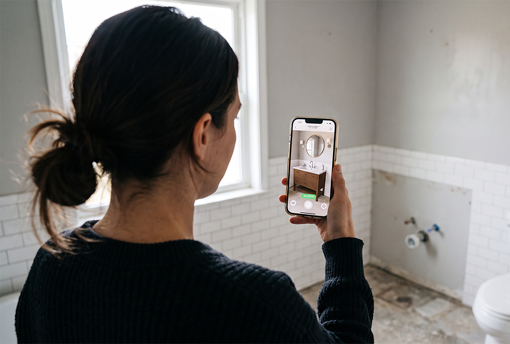 Customer using an AR visualiser on a phone to preview bathroom furniture